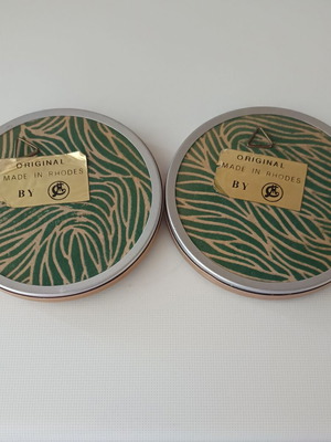 Two round butterfly wall clocks with domed glass