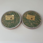 Two round butterfly wall clocks with domed glass