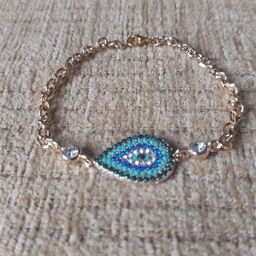 Gold bracelet new with eye and blue, turquoise, white stones