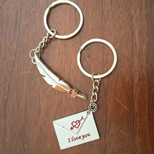 Keychain set for couples like new, silver color