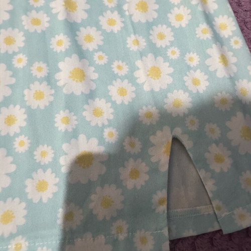 Mini skirt with daisies on blue background, size S, like new