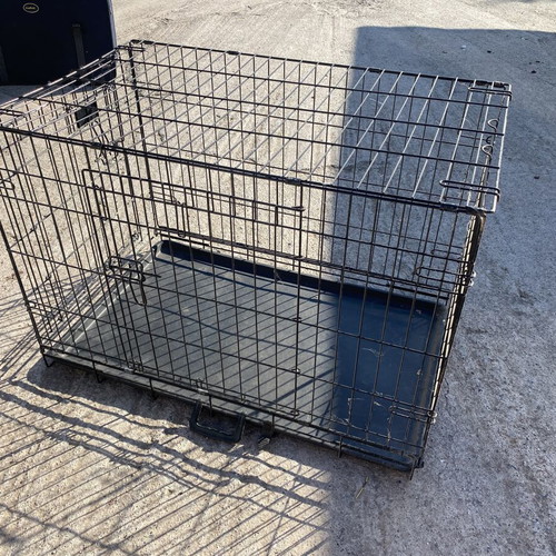 Dog crate used for a large dog with two doors and cleaning tray