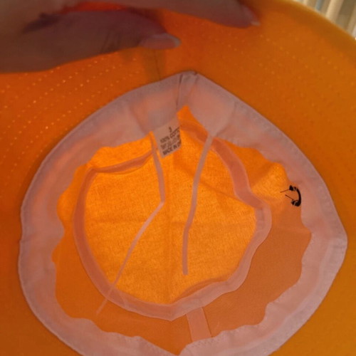 Hat new, orange with adjustable cords