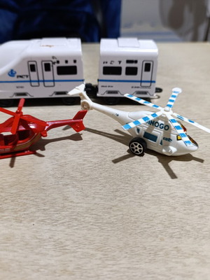 Plastic helicopter and train figures used