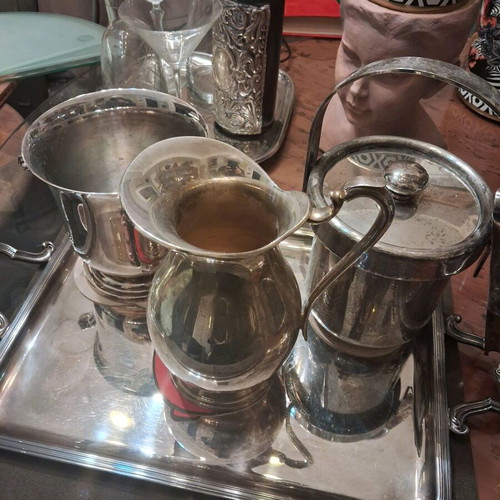 Silver-plated utensils used, set with Christofle tray and Lampidis jug