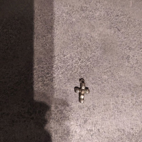 Cross pendant used with small diamonds gold and silver