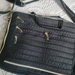 Laptop bag like new, black with multiple compartments and adjustable shoulder strap
