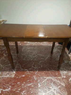 Wooden dining table with extension used
