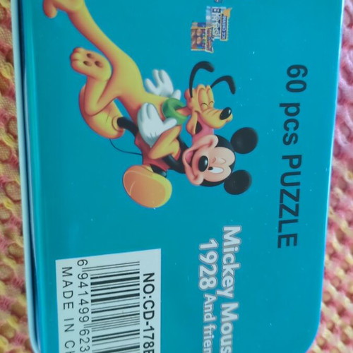 Mickey Mouse puzzle 60 pieces in metal box like new