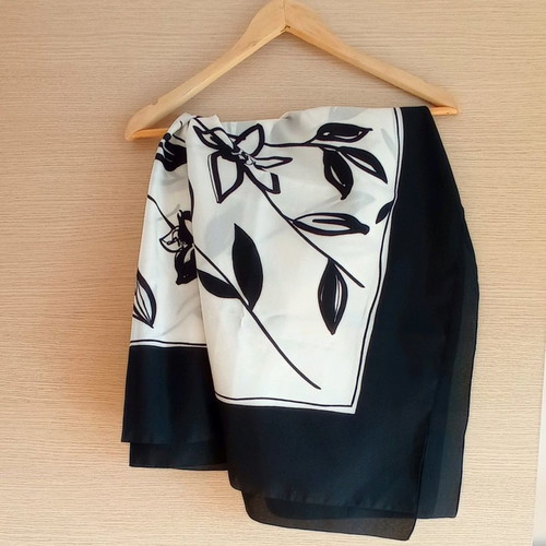 Large scarf used with floral pattern in black and white