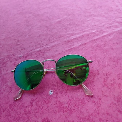 Round sunglasses with green mirrored lenses used, gold frame