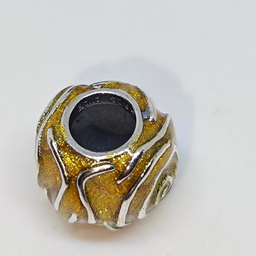 Silver charm bead with gold glitter enamel spiral design like new