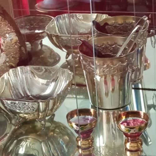 Silver-plated vintage ice bucket used with tongs