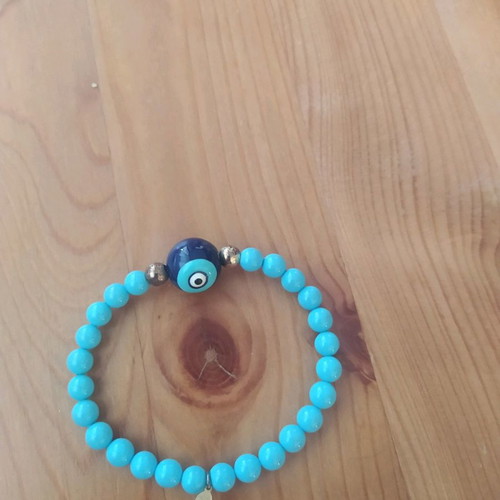 Bracelet with eye and blue beads new, fits all wrists