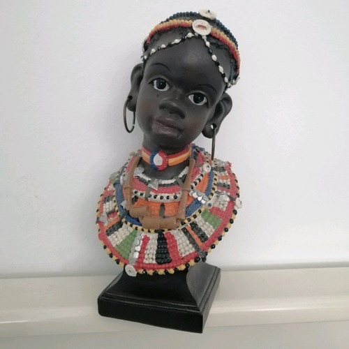 African figurine like new with intricate bead jewelry