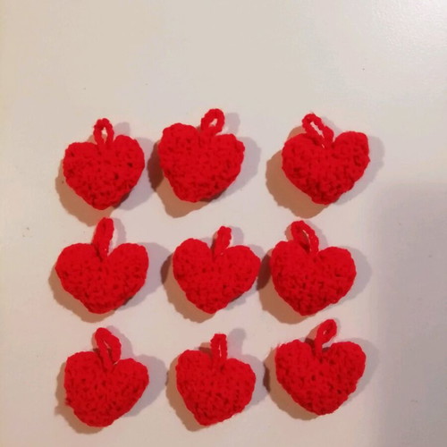 Knitted hanging red hearts like new