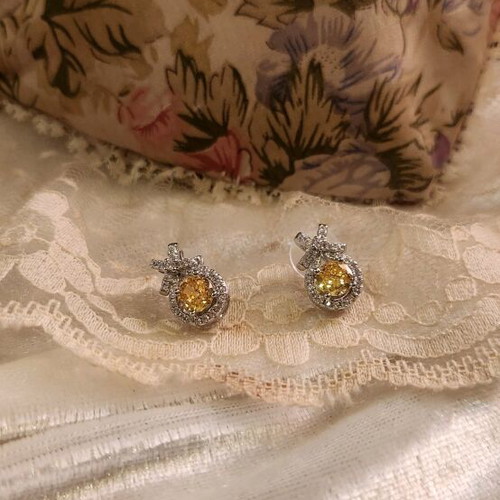 Steel earrings new with yellow stone and small diamonds