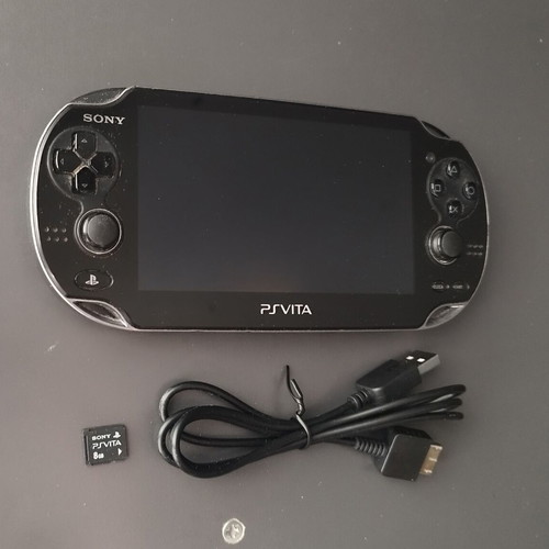 Sony PlayStation Vita PCH-1004 OLED used with memory and USB charger