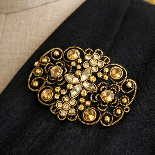 Vintage brooch used with filigree design and gold finish