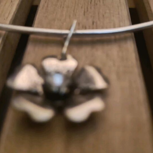 Silver-colored handmade necklace with flower like new