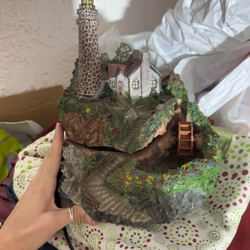 Decorative table fountain with lighthouse and house