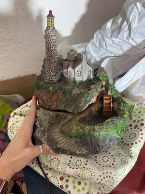Decorative table fountain with lighthouse and house
