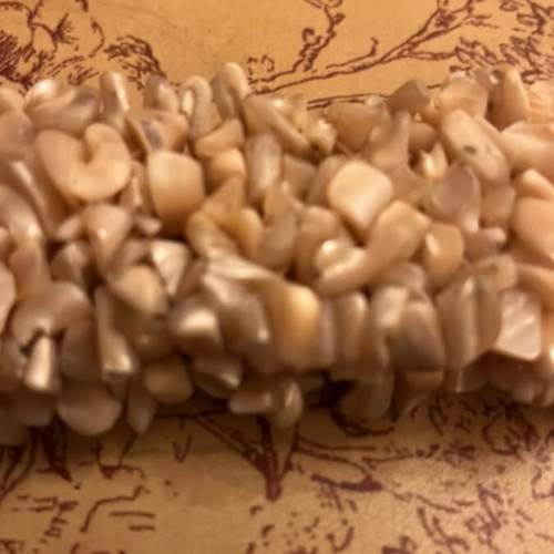 Shell bracelet like new, elastic with natural beige pieces