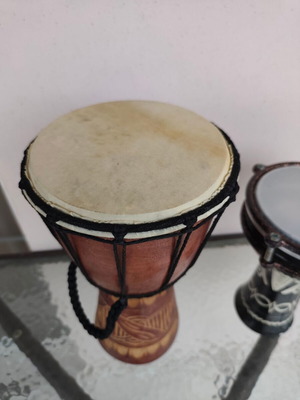 Ethnic percussion set used: Wooden Djembe and Darbuka tambourine mini