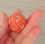 Small orange ball used with design