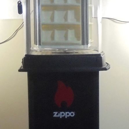 Zippo lighter display stand used, illuminated and rotating with storage base for 60 lighters