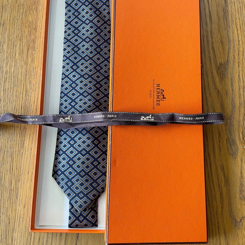 Hermes silk tie new with dark blue background