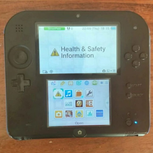 Nintendo 2DS used with stylus and charger