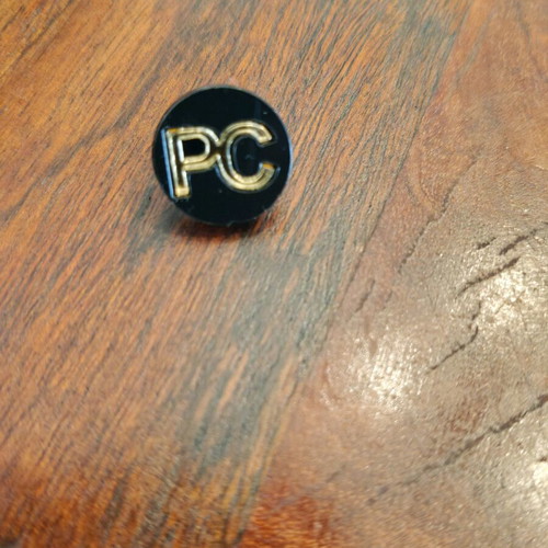 Men's lapel pin like new, black and gold