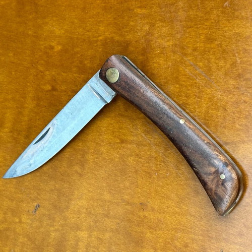 Vintage folding pocket knife with wooden handle, used, 10.7 cm