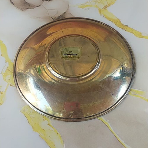 Decorative plate, possibly brass
