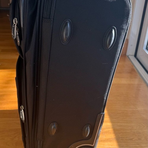Delsey suitcase used with wheels small size black