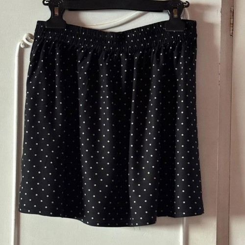Pink Woman polka dot skirt with buttons, black and white
