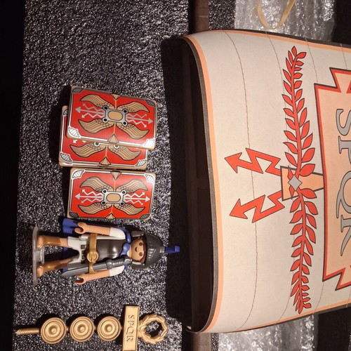 Playmobil Roman set used with character, gun, helmet, shields, boat, and horses