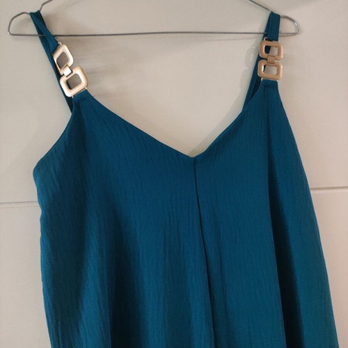 Jumpsuit like new with gold detail on straps, turquoise color