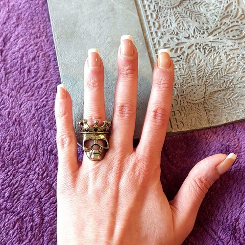 Bronze skull ring with crown, rock style
