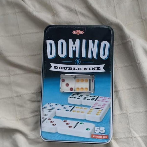 Domino board game used, complete with metal box