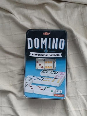 Domino board game used, complete with metal box