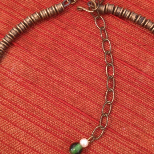 Handmade traditional vintage necklace with green beads and bronze details