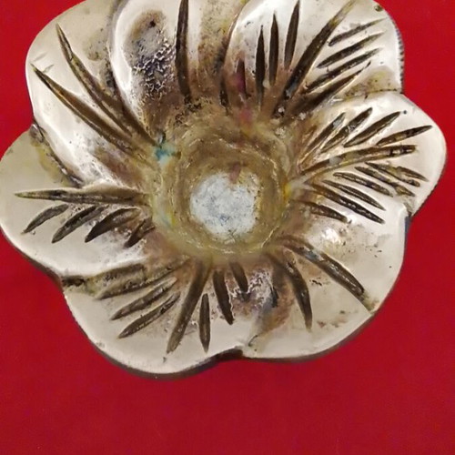 Carved brass decorative item, useful as ashtray or candle holder