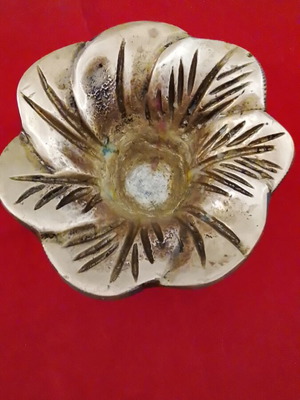 Carved brass decorative item, useful as ashtray or candle holder