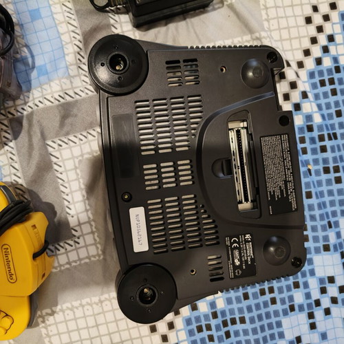 Nintendo 64 console used with jumper pack, power supply, cables, and two faulty controllers