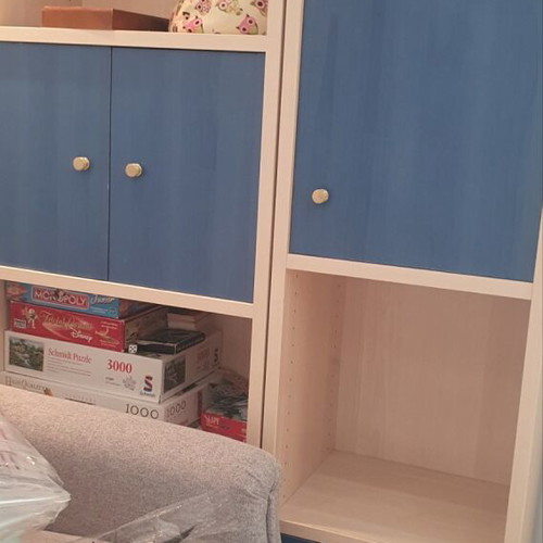 Blue bedroom set with desk, bookshelves and bed