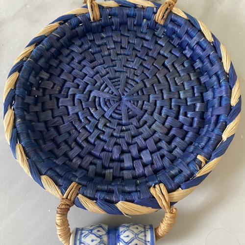 Blue handmade wicker basket with painted porcelain handles like new