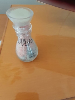 Decorative jar from Dubai used with sealed lid and slight chip, 9 cm height