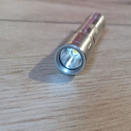 Mini stainless steel LED flashlight like new, AAA battery